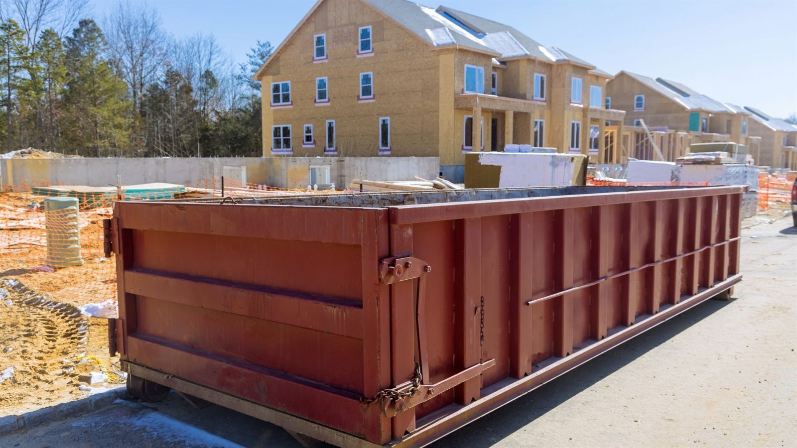 Construction debris loaded in dumpster