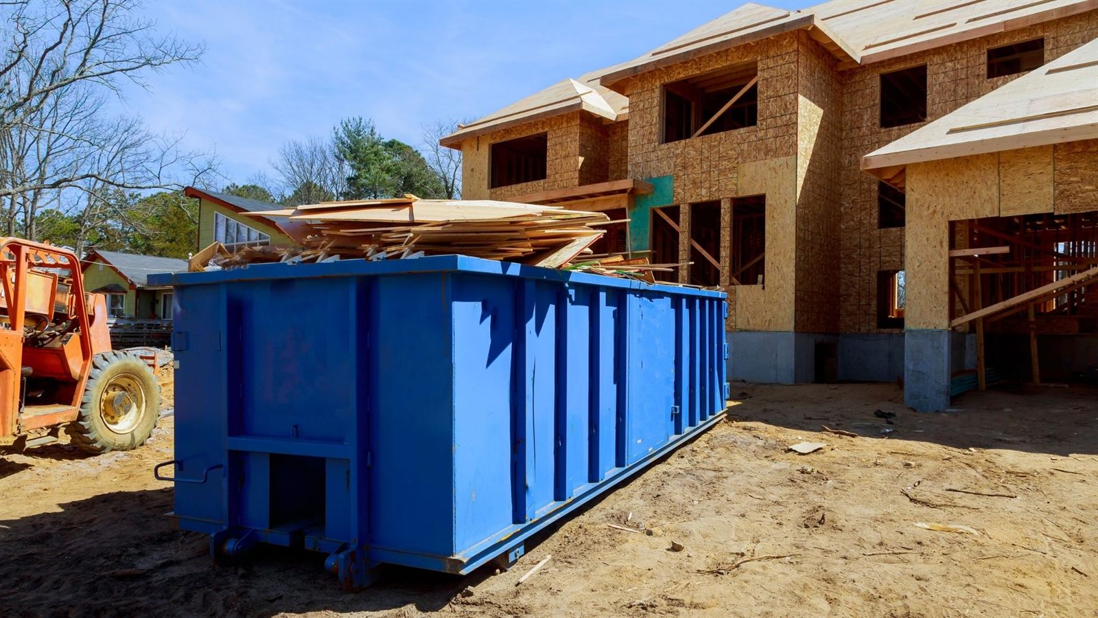 Dump trailer loaded with debris at home cleanup